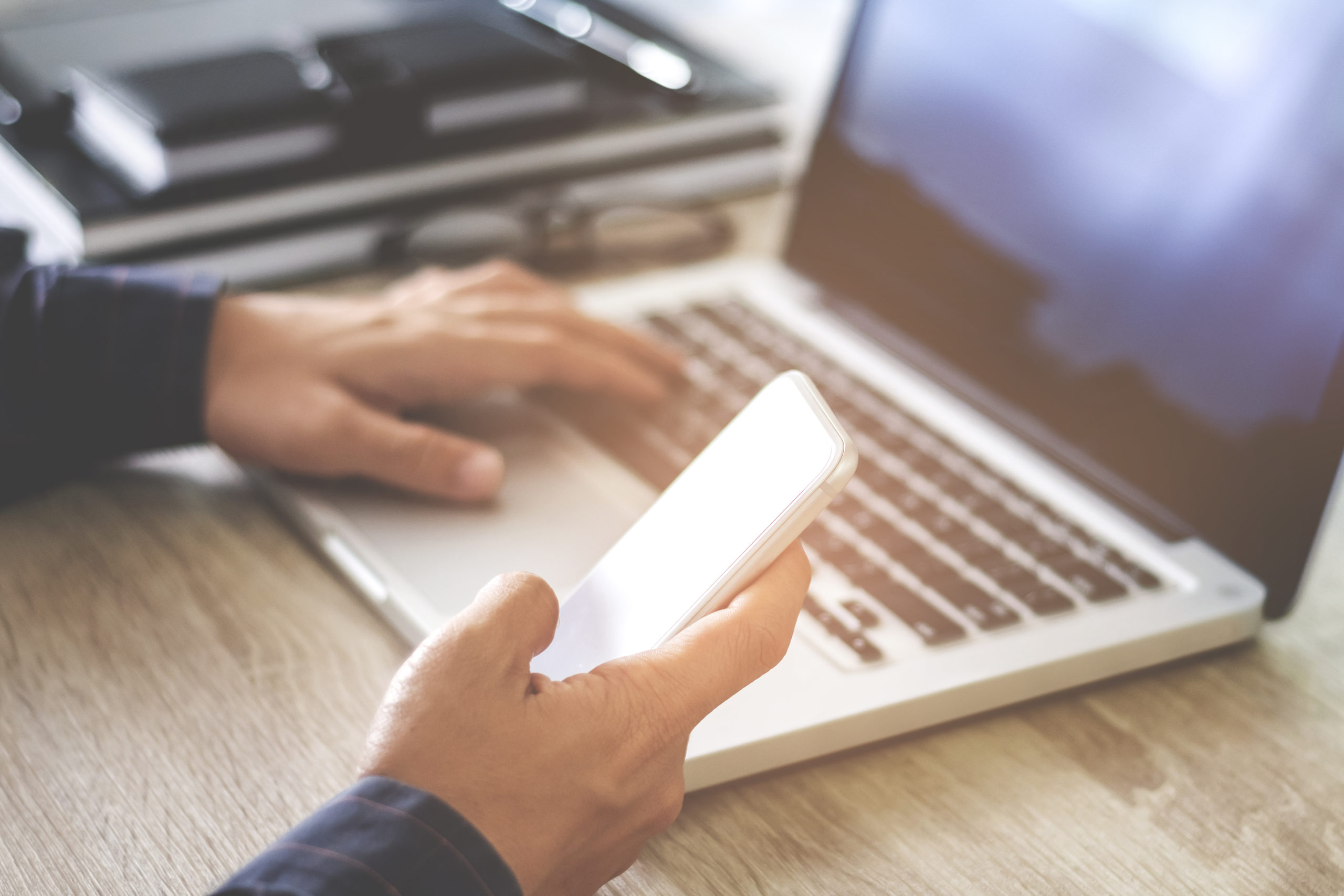 man using mobile smartphone shopping online with laptop, payment and marketing concept