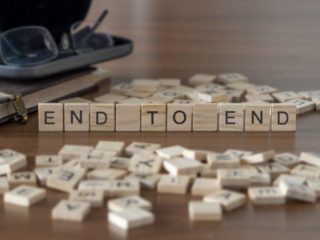 End To End the word or concept represented by wooden letter tiles