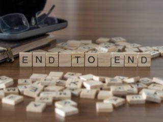 End To End the word or concept represented by wooden letter tiles