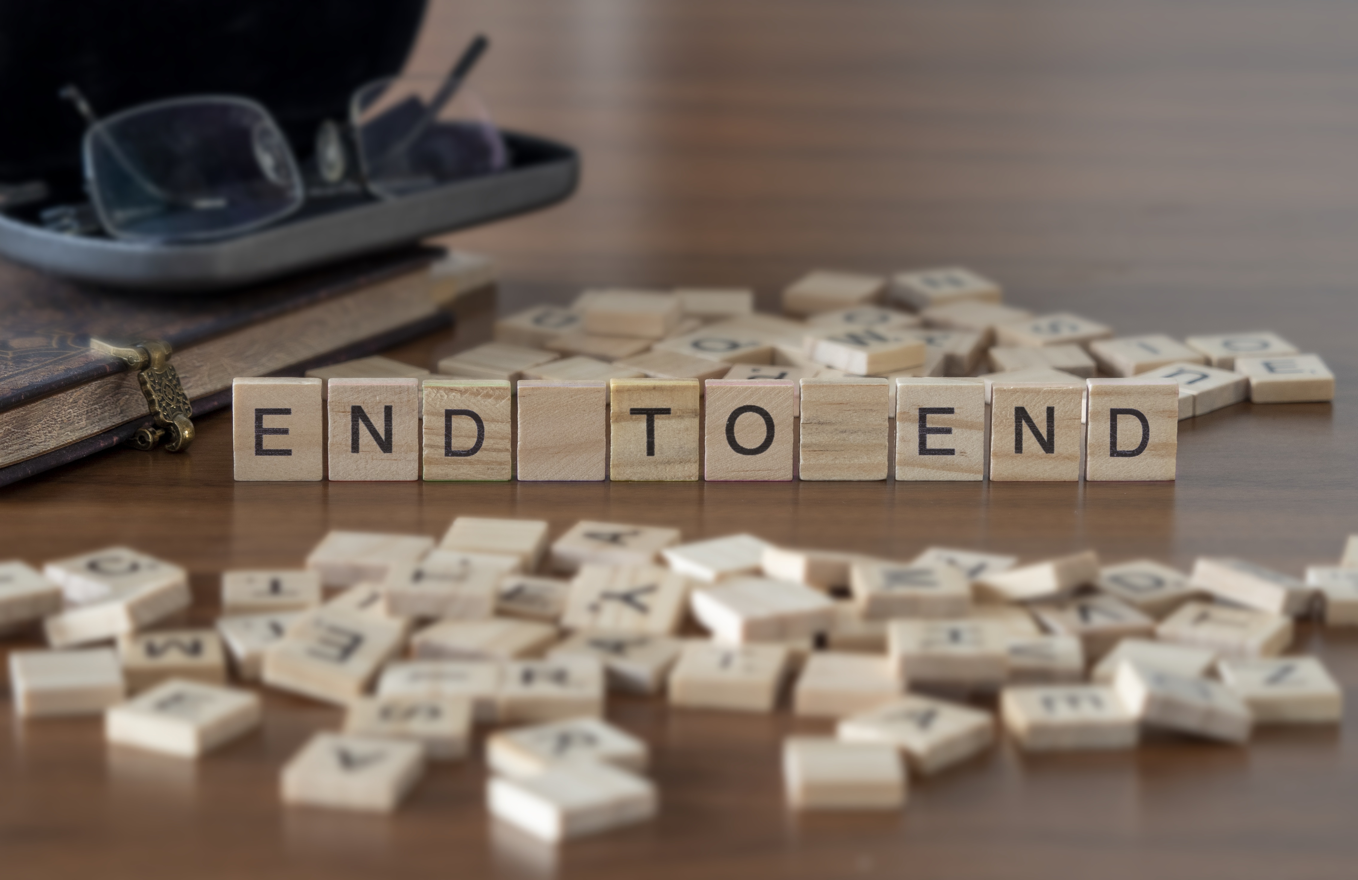 End To End the word or concept represented by wooden letter tiles