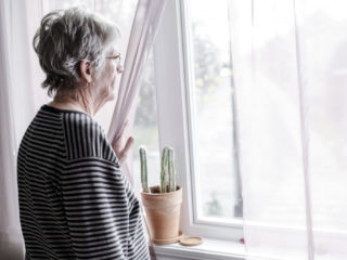 worried senior woman at home felling very bad