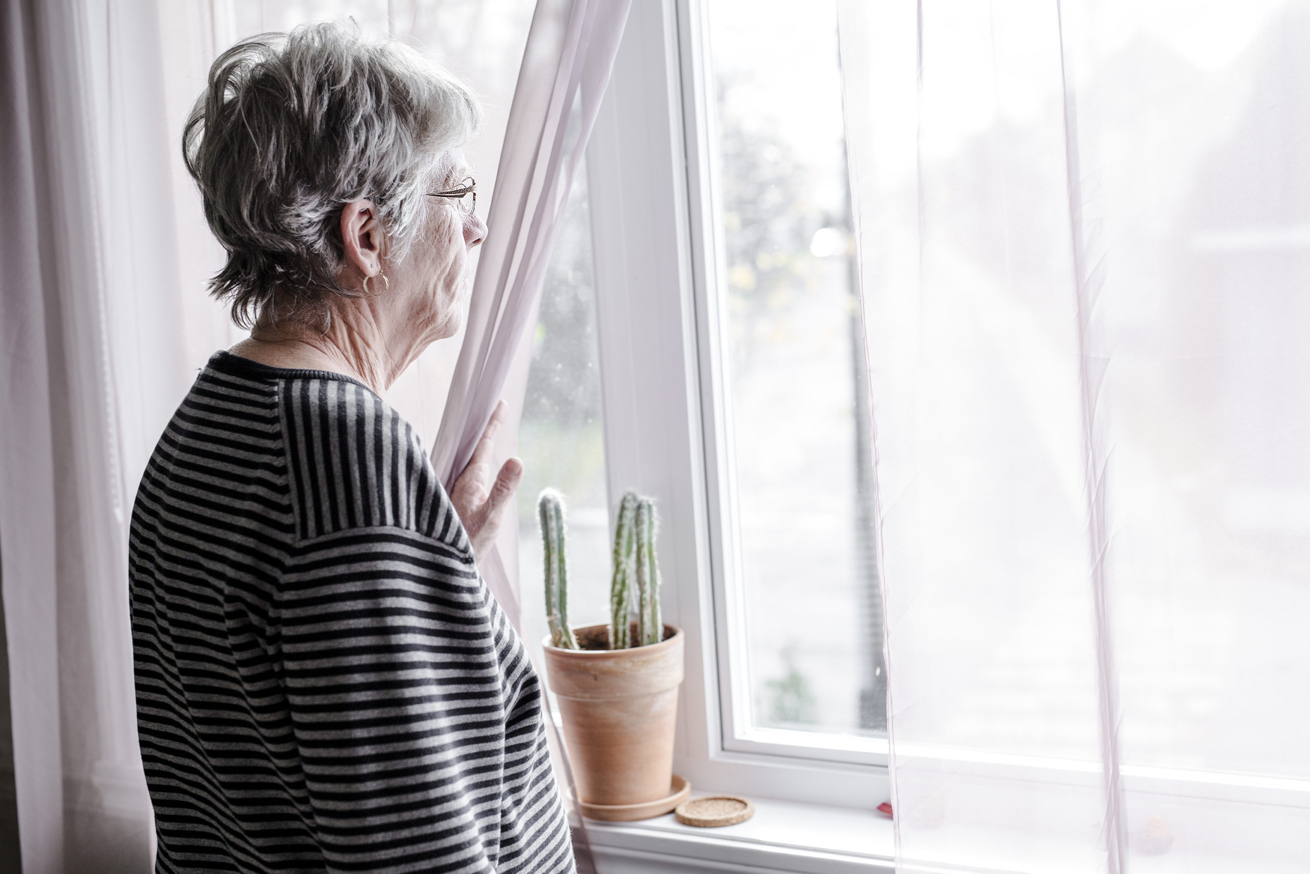 worried senior woman at home felling very bad