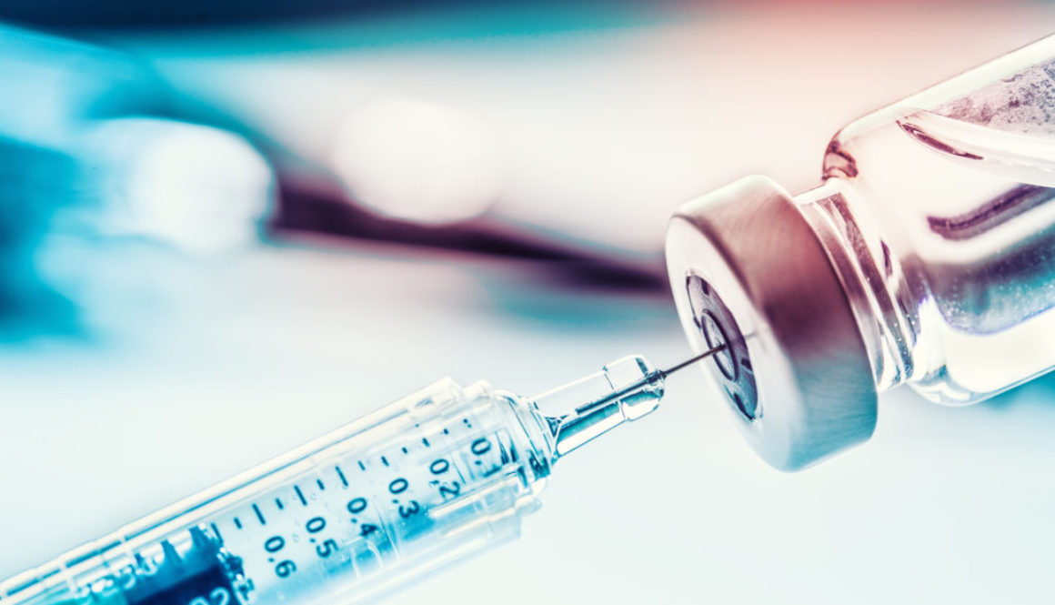 Close-up medical syringe with a vaccine.